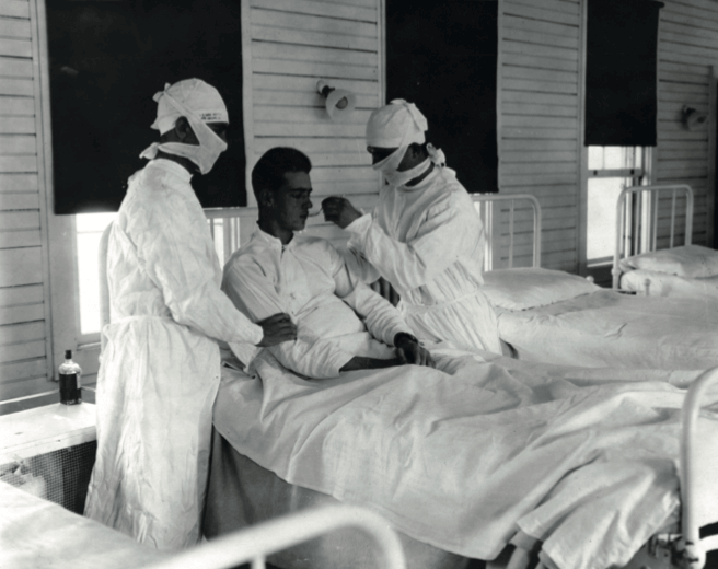 אדם המקבל טיפול בשפעת בניו אורלינס, לואיזיאנה, בסביבות שנת 1918 - מדע - מדע פלוס